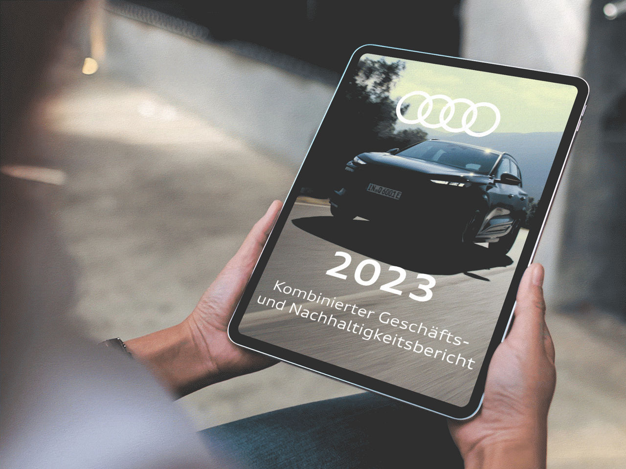 A moving image of an Audi model on a tablet